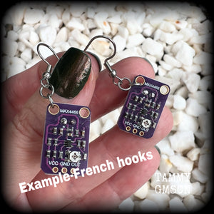 These awesome dark purple circuit board earrings measure just on 5.5cms from tip to tip, and weigh only a few grams each, these are lovely and lightweight and not too dangly.

This pair has been made on stainless steel french hooks, to be worn in pierced ears.