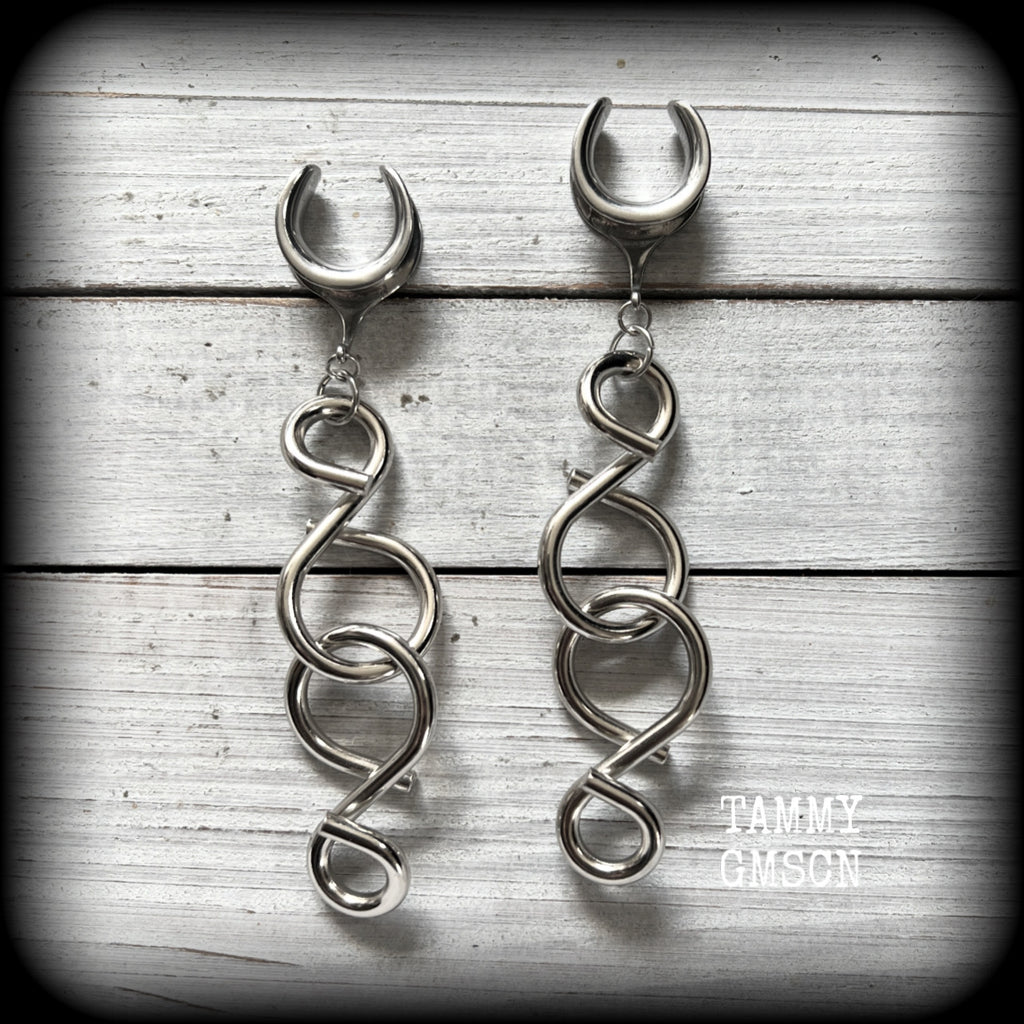 These awesome gauged earrings feature twisted and knotted surgical steel pieces, weighing approx 19 grams a piece, and nice and dangly at just on 11cms from tip to tip.

This pair has been made with 5/8” gauge (16mm) surgical steel cradles, suitable for stretched lobes.