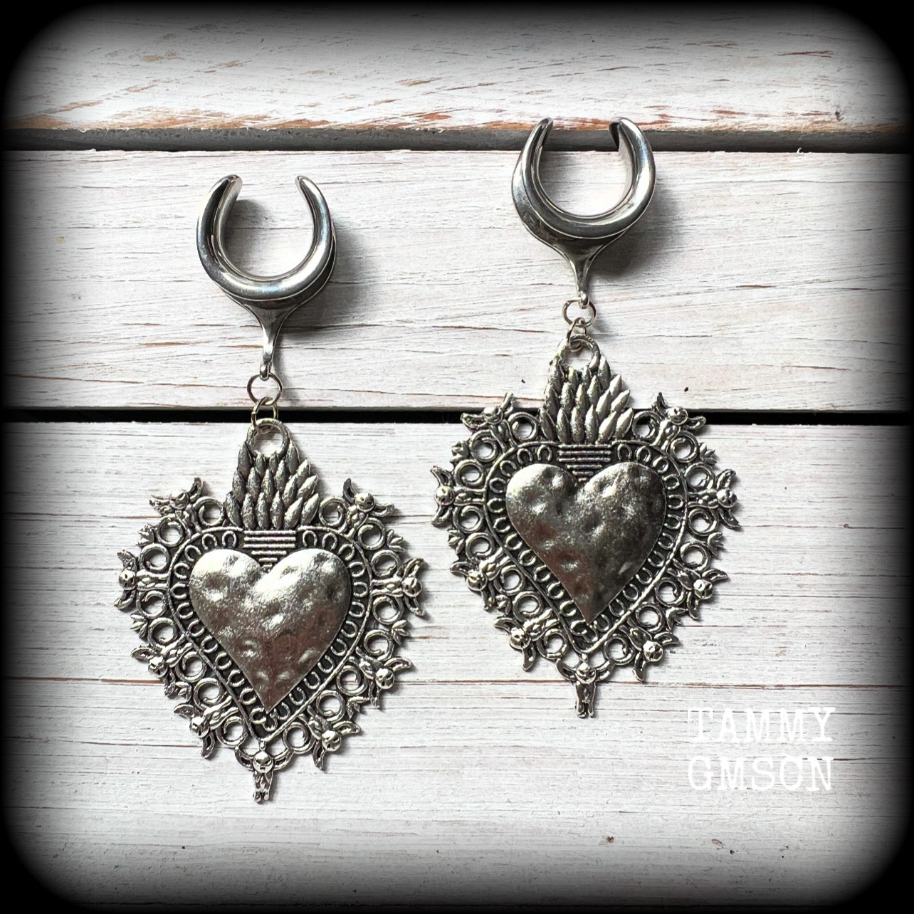These gorgeous antique silver gauged earrings feature big beautiful sacred hearts, measuring 9cms from tip to tip, and weighing approx 14 grams each.

This pair has been made on 5/8” gauge (16mm) surgical steel cradles, to be worn in stretched lobes.