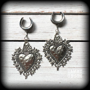 These gorgeous antique silver gauged earrings feature big beautiful sacred hearts, measuring 9cms from tip to tip, and weighing approx 14 grams each.

This pair has been made on 5/8” gauge (16mm) surgical steel cradles, to be worn in stretched lobes.