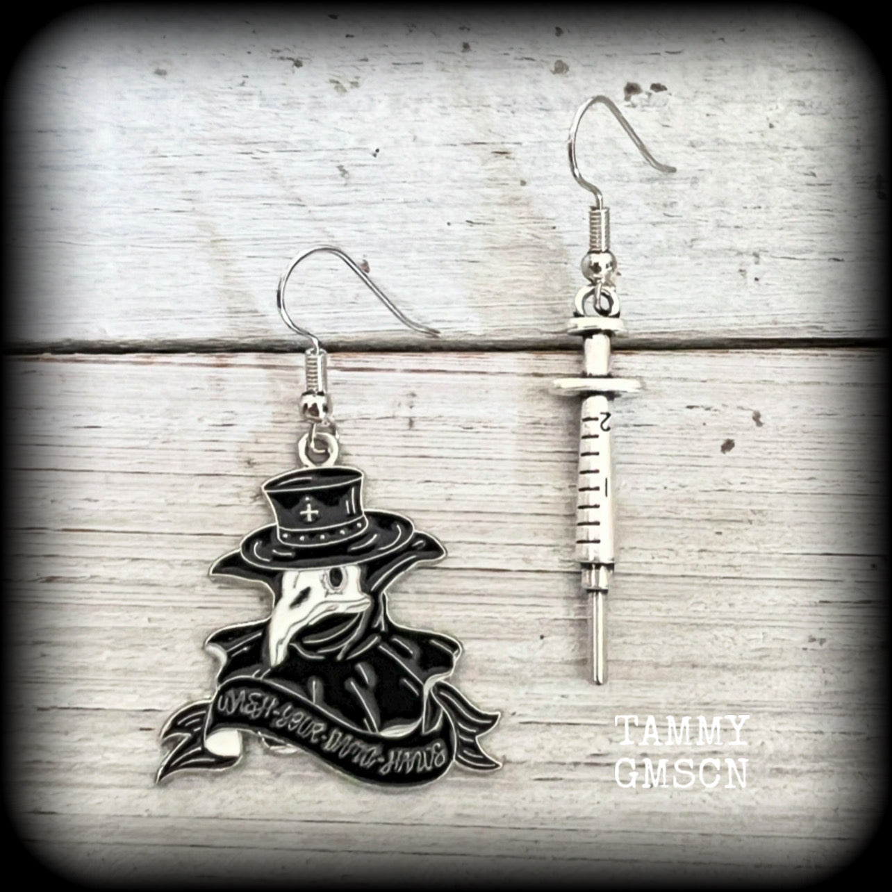 ✨ WASH YOUR HANDS ✨

Featuring lightweight antique silver syringes and black and white enamel Plague Doctor masks, these awesome earrings measure just under 6cms from tip to tip and weigh only a gram or two each.

This pair has been made with stainless steel french hooks, for pierced ears.