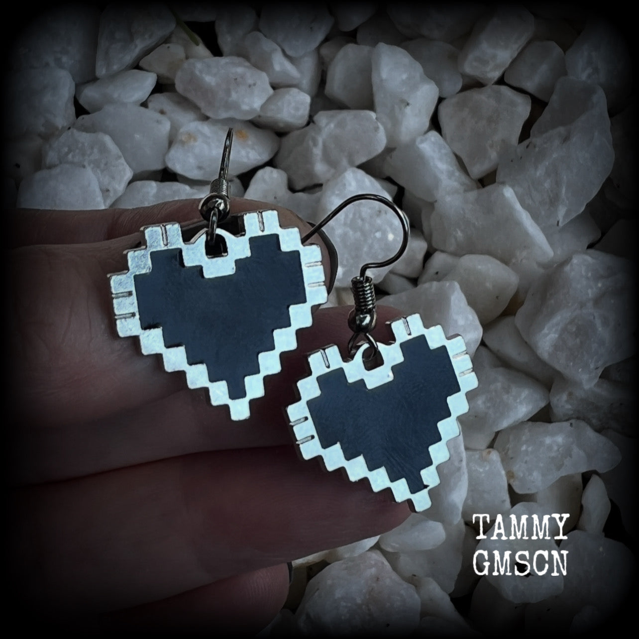 This pair of super cute earrings features black enamel and antique silver pixel hearts, measuring just under 4cms from tip to tip, and weighing only a few grams each.  This pair has been made with stainless steel french hooks, to be worn in pierced ears.