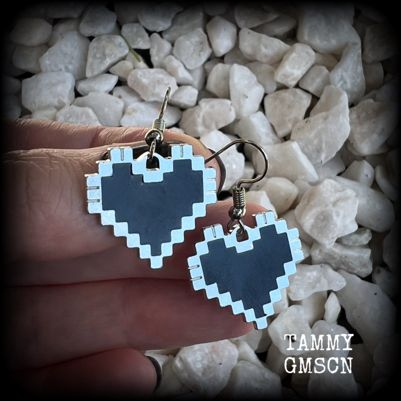 This pair of super cute earrings features black enamel and antique silver pixel hearts, measuring just under 4cms from tip to tip, and weighing only a few grams each.  This pair has been made with stainless steel french hooks, to be worn in pierced ears.