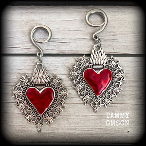 These gorgeous antique silver and red enamel gauged earrings feature big beautiful sacred hearts, measuring 8.5cms from tip to tip, and weighing approx 14 grams each.

This pair has been made on 6 gauge (4mm) surgical steel full curls, to be worn in stretched lobes.