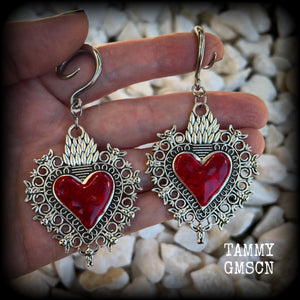 These gorgeous antique silver and red enamel gauged earrings feature big beautiful sacred hearts, measuring 8.5cms from tip to tip, and weighing approx 14 grams each.  This pair has been made on 6 gauge (4mm) surgical steel full curls, to be worn in stretched lobes.