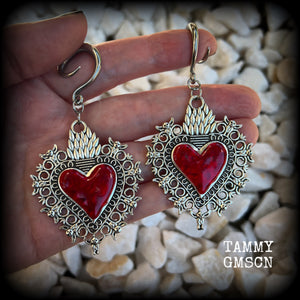 These gorgeous antique silver and red enamel gauged earrings feature big beautiful sacred hearts, measuring 8.5cms from tip to tip, and weighing approx 14 grams each.  This pair has been made on 6 gauge (4mm) surgical steel full curls, to be worn in stretched lobes.