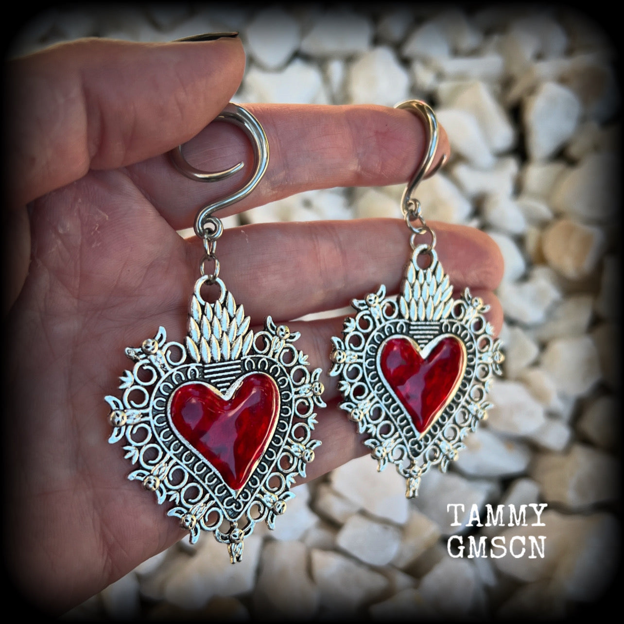 These gorgeous antique silver and red enamel gauged earrings feature big beautiful sacred hearts, measuring 8.5cms from tip to tip, and weighing approx 14 grams each.  This pair has been made on 6 gauge (4mm) surgical steel full curls, to be worn in stretched lobes.