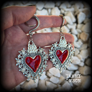 These gorgeous antique silver and red enamel gauged earrings feature big beautiful sacred hearts, measuring 8.5cms from tip to tip, and weighing approx 14 grams each.  This pair has been made on 6 gauge (4mm) surgical steel full curls, to be worn in stretched lobes.