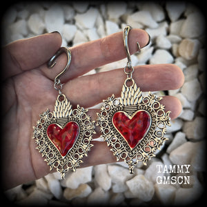 These gorgeous antique silver and red enamel gauged earrings feature big beautiful sacred hearts, measuring 8.5cms from tip to tip, and weighing approx 14 grams each.  This pair has been made on 6 gauge (4mm) surgical steel full curls, to be worn in stretched lobes.