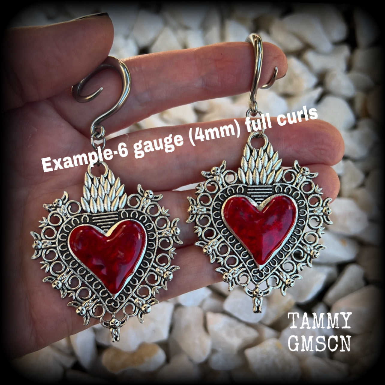 These gorgeous antique silver and red enamel gauged earrings feature big beautiful sacred hearts, measuring 8.5cms from tip to tip, and weighing approx 14 grams each.  This pair has been made on 6 gauge (4mm) surgical steel full curls, to be worn in stretched lobes.