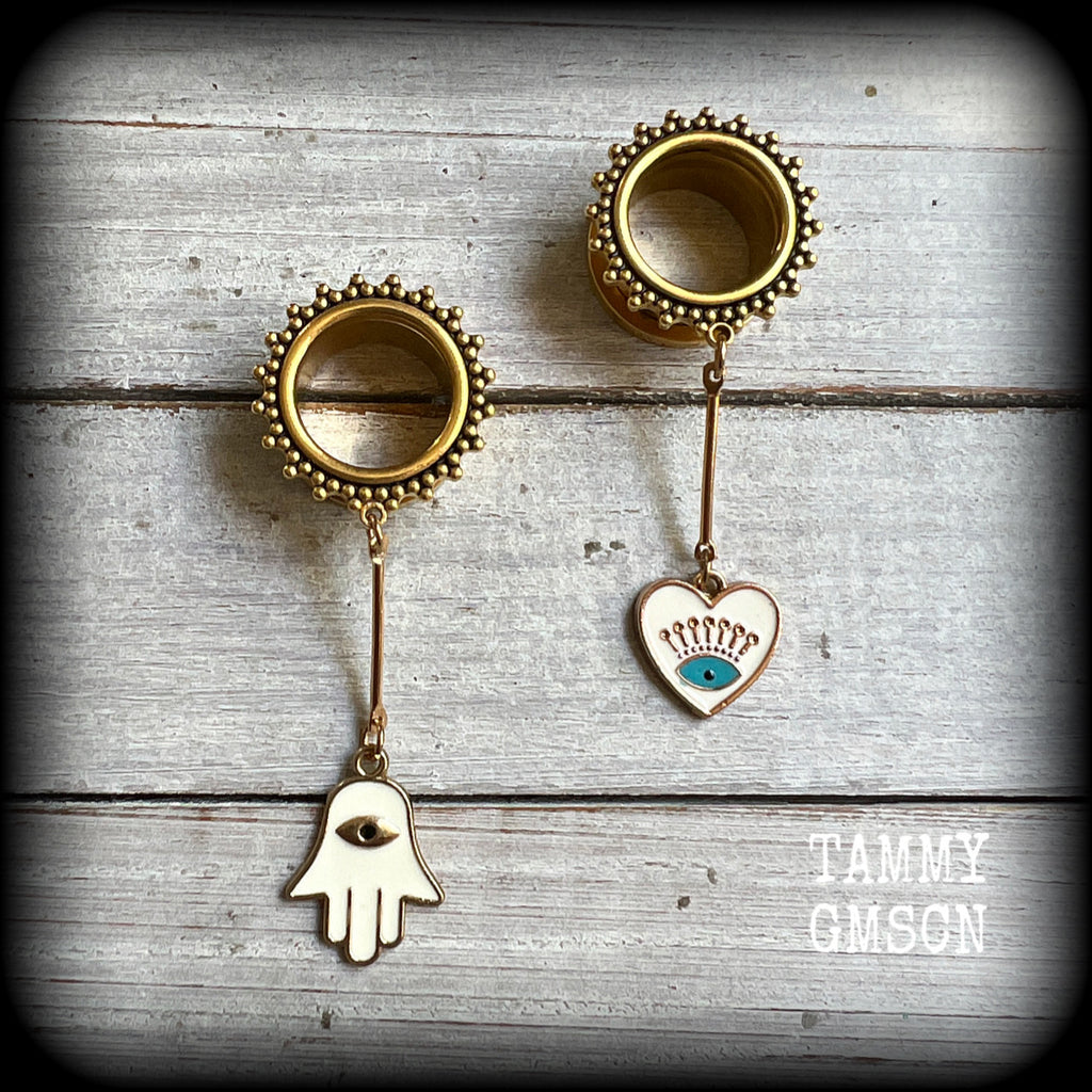 These tunnel earrings feature gold enamel hamsa hand and evil eye charms, weighing approx 9 grams each and measuring just over 6cms.
This pair have been made with 5/8" (16mm) gauge ornate titanium coated surgical steel screw fit tunnels.