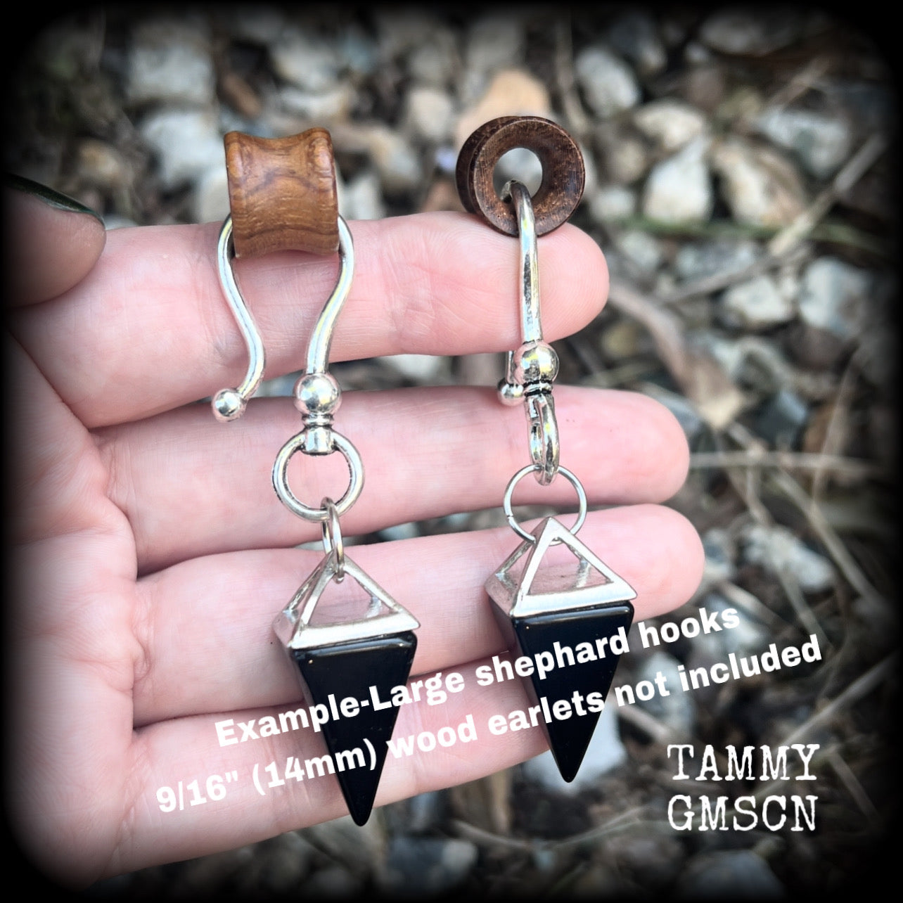 This is a pair of gorgeous pitch black onyx gemstone earrings, not too heavy at approx 10 grams a piece, and measuring just on 7cms from tip to tip.

This pair has been made with large antique silver shephards hooks, to be worn through silicone earlets in stretched lobes from 2 gauge (6mm).