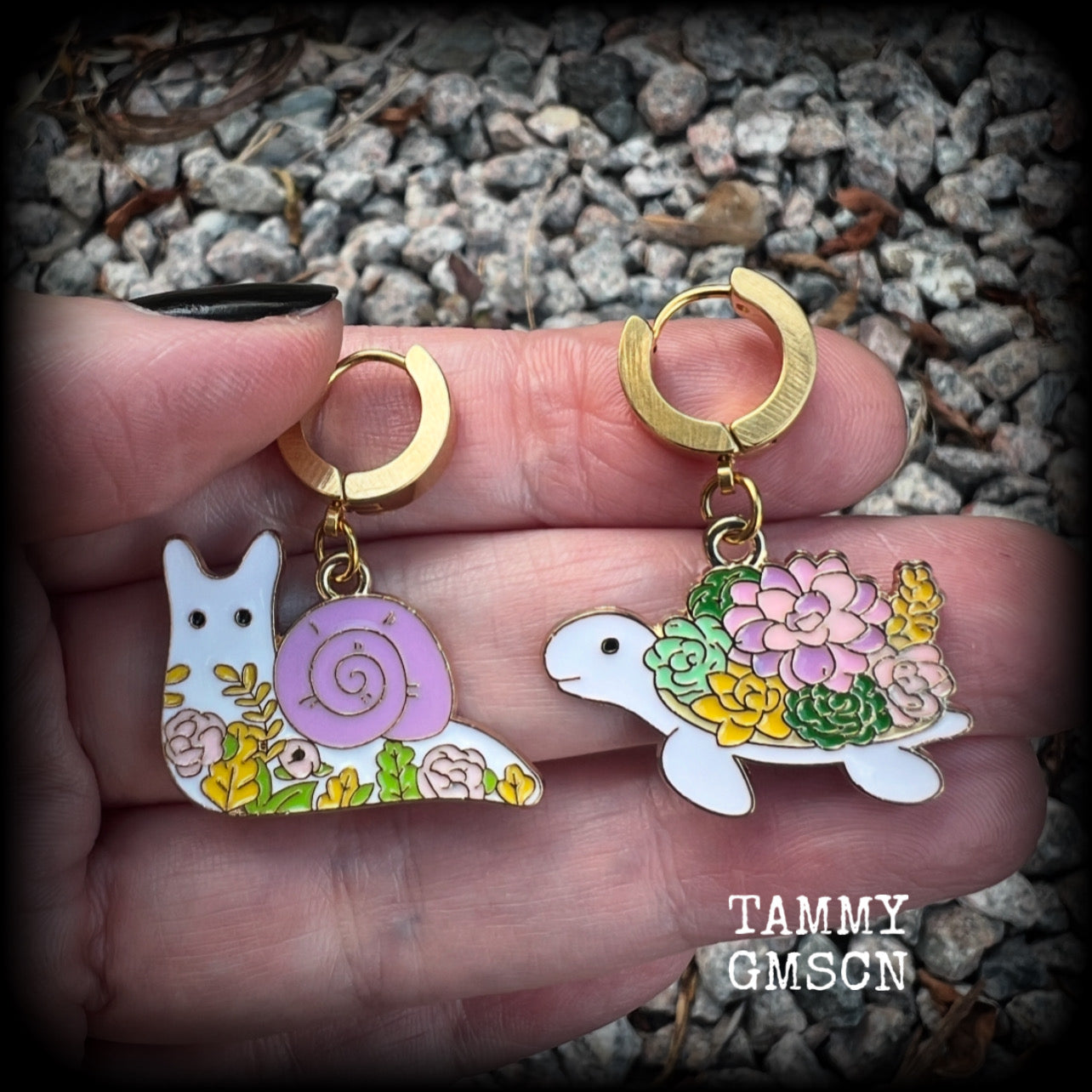 These adorable earrings feature antique gold and enamel garden snails and turtles with floral embellishments, are nice and lightweight at only a few grams each, and measure in at approx 4cm from tip to tip.

This pair have been made on stainless steel huggie ear cuffs, suitable for pierced ears.
