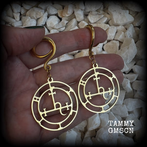 These gorgeous gold stainless steel earrings feature the Sigil of Lilith as it appears in The Lesser Key of Solomon, and are lovely and light weight, weighing only 7 grams each, and measure just on 7cms from tip to tip.

This pair has been made with 6 gauge (4mm) surgical steel full curl hooks, to be worn in stretched lobes..