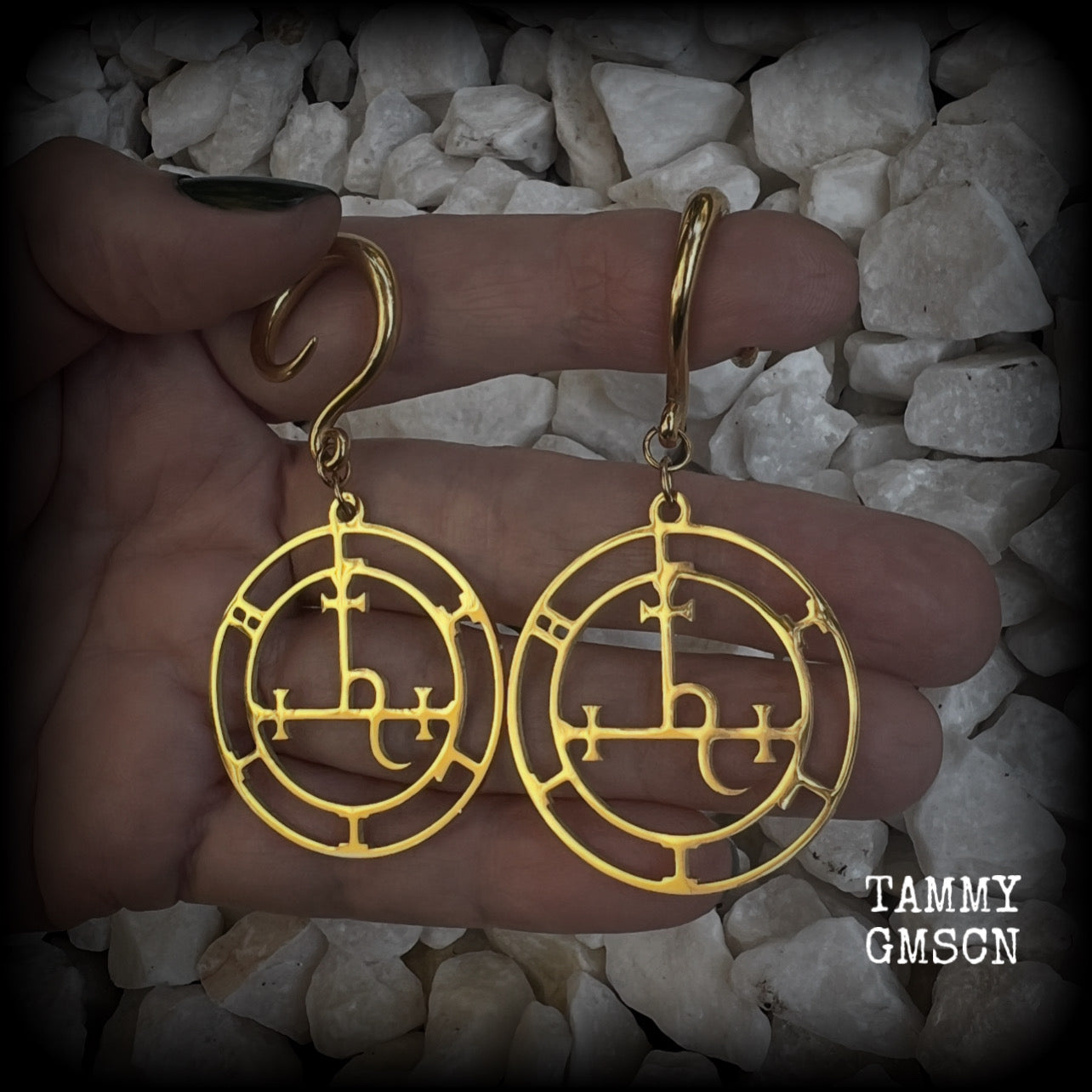 These gorgeous gold stainless steel earrings feature the Sigil of Lilith as it appears in The Lesser Key of Solomon, and are lovely and light weight, weighing only 7 grams each, and measure just on 7cms from tip to tip.

This pair has been made with 6 gauge (4mm) surgical steel full curl hooks, to be worn in stretched lobes..