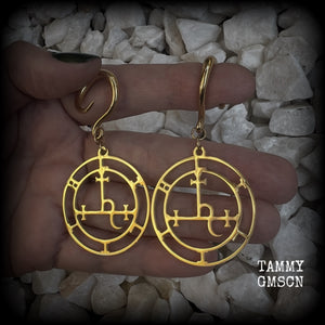 These gorgeous gold stainless steel earrings feature the Sigil of Lilith as it appears in The Lesser Key of Solomon, and are lovely and light weight, weighing only 7 grams each, and measure just on 7cms from tip to tip.

This pair has been made with 6 gauge (4mm) surgical steel full curl hooks, to be worn in stretched lobes..