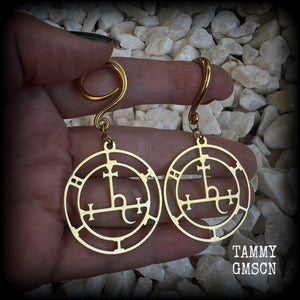 These gorgeous gold stainless steel earrings feature the Sigil of Lilith as it appears in The Lesser Key of Solomon, and are lovely and light weight, weighing only 7 grams each, and measure just on 7cms from tip to tip.

This pair has been made with 6 gauge (4mm) surgical steel full curl hooks, to be worn in stretched lobes..