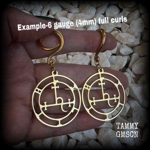 These gorgeous gold stainless steel earrings feature the Sigil of Lilith as it appears in The Lesser Key of Solomon, and are lovely and light weight, weighing only 7 grams each, and measure just on 7cms from tip to tip.

This pair has been made with 6 gauge (4mm) surgical steel full curl hooks, to be worn in stretched lobes..