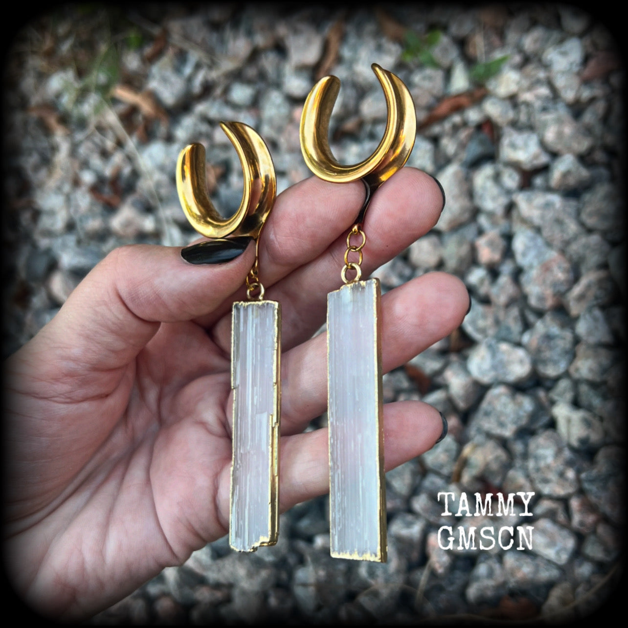 Measuring just over 10 from tip to tip, and weighing around 14 grams each a piece, these Selenite gauged earrings are simply beautiful!

This pair has been made on 7/8” gauge (22mm) surgical steel cradles, to be worn in stretched lobes.