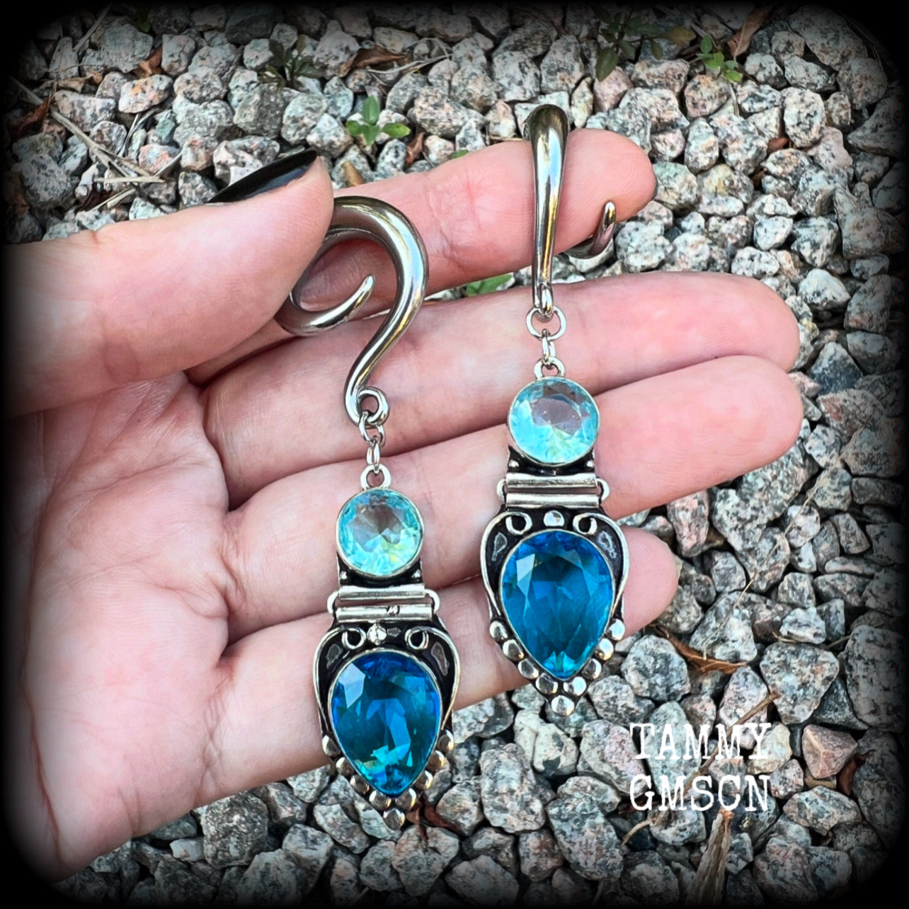 These gorgeous gauged earrings feature facet ocean blue topaz and quartz gemstones in a beautifully boho antique silver setting, lovely and dangly at approx 7.5cms from tip to tip, and not too heavy at only 12 grams each.

These earrings have been made on 2 gauge (6mm) surgical steel full curl hooks, to be worn in stretched lobes.