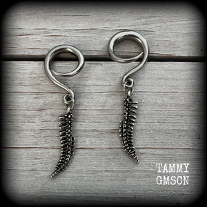 Featuring a pair of awesome antique silver spinal cords, these earrings are super lightweight, weighing in at only 3 grams a piece, and are nice and dangly at just on 5.5cms.

This pair has been made on 6 gauge (4mm) surgical steel full curl hooks, to be worn in stretched lobes.