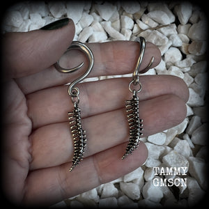 Featuring a pair of awesome antique silver spinal cords, these earrings are super lightweight, weighing in at only 3 grams a piece, and are nice and dangly at just on 5.5cms.

This pair has been made on 6 gauge (4mm) surgical steel full curl hooks, to be worn in stretched lobes.