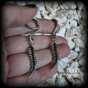 Featuring a pair of awesome antique silver spinal cords, these earrings are super lightweight, weighing in at only 3 grams a piece, and are nice and dangly at just on 5.5cms.

This pair has been made on 6 gauge (4mm) surgical steel full curl hooks, to be worn in stretched lobes.