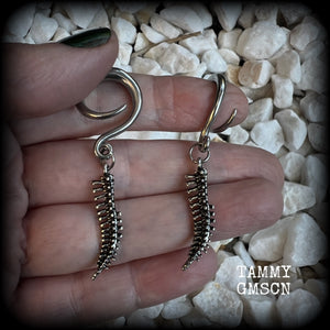 Featuring a pair of awesome antique silver spinal cords, these earrings are super lightweight, weighing in at only 3 grams a piece, and are nice and dangly at just on 5.5cms.

This pair has been made on 6 gauge (4mm) surgical steel full curl hooks, to be worn in stretched lobes.