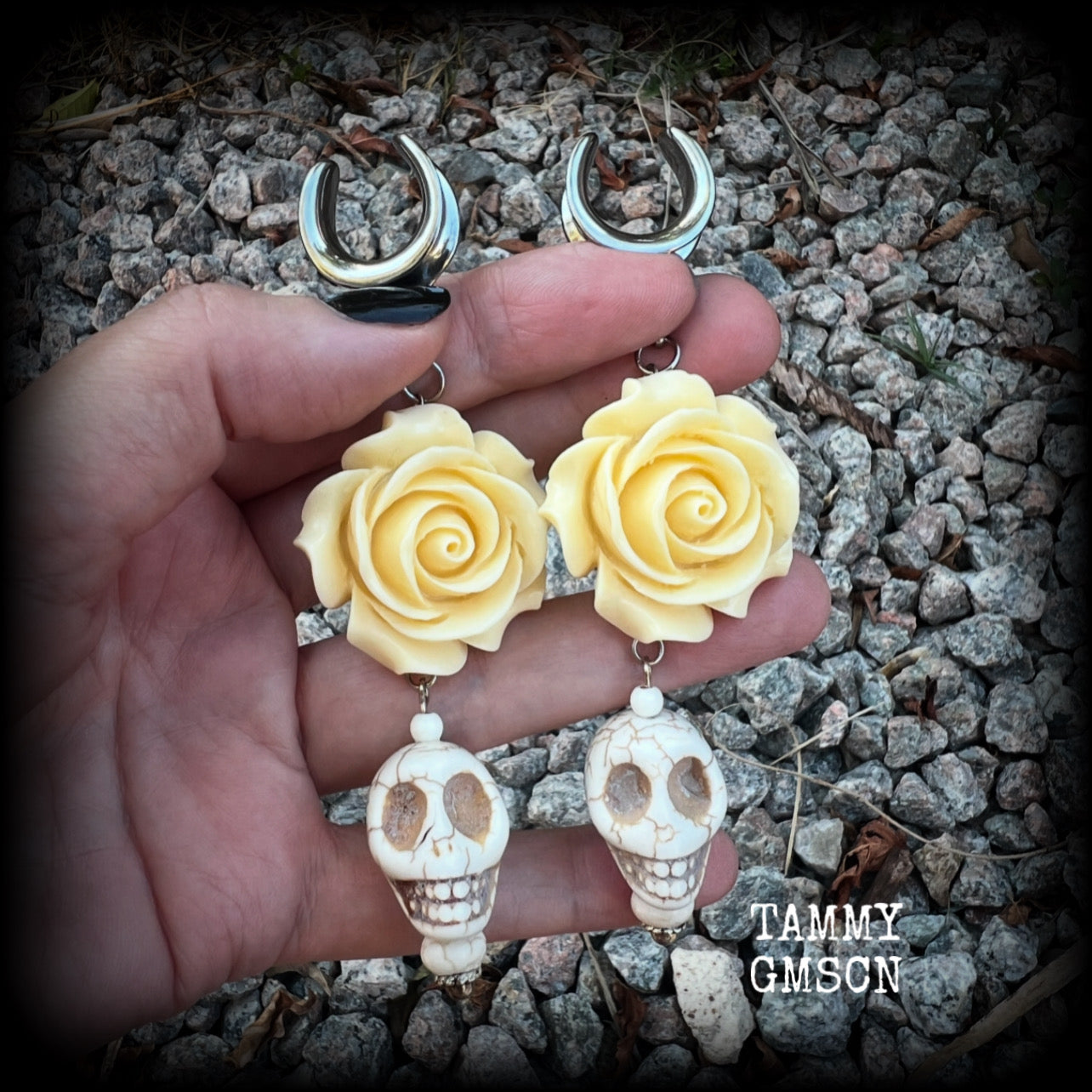 Featuring large bone white stone skulls hanging beneath gorgeous cream coloured roses, these earrings are perfect for Day of the Dead celebrations!  These gorgeous gauged earrings are big and beautiful, weighing in at around 20 grams a piece, and nice and dangly at just under 11cms from tip to tip.  This pair have been made with 5/8” gauge (16mm) surgical steel cradles, suitable for stretched lobes.