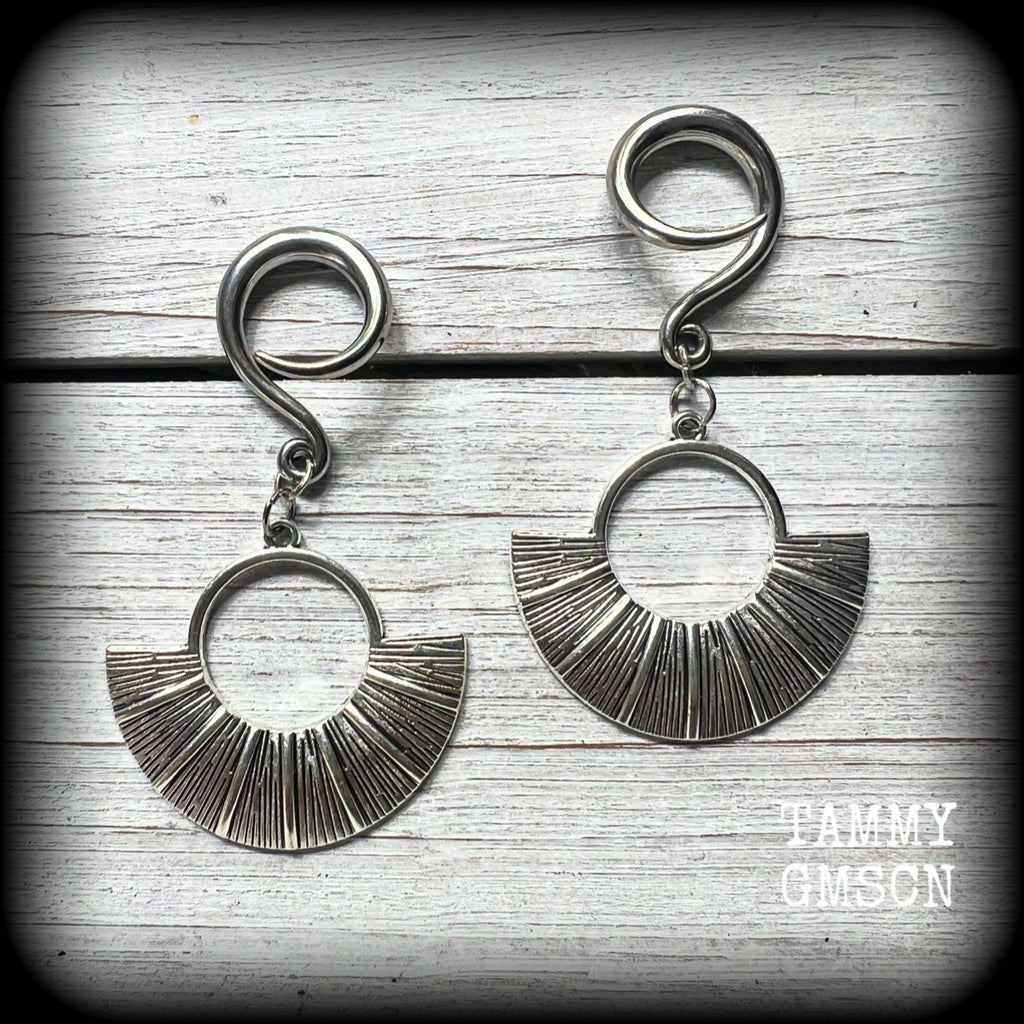 Inspired by Ishtar, Mesopotamian Goddess of love, beauty, sex and war, these unique ethnic inspired gauged earrings feature lovely dangly antique silver battle shields, nice and lightweight at approx 6 grams each, and nice and dangly at 6.5 cms from tip to tip.

This pair has been made on 6 gauge (4mm) surgical steel full curl hooks, to be worn in stretched lobes.
