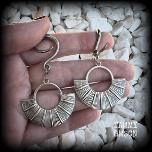 Inspired by Ishtar, Mesopotamian Goddess of love, beauty, sex and war, these unique ethnic inspired gauged earrings feature lovely dangly antique silver battle shields, nice and lightweight at approx 6 grams each, and nice and dangly at 6.5 cms from tip to tip.

This pair has been made on 6 gauge (4mm) surgical steel full curl hooks, to be worn in stretched lobes.