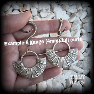 Inspired by Ishtar, Mesopotamian Goddess of love, beauty, sex and war, these unique ethnic inspired gauged earrings feature lovely dangly antique silver battle shields, nice and lightweight at approx 6 grams each, and nice and dangly at 6.5 cms from tip to tip.

This pair has been made on 6 gauge (4mm) surgical steel full curl hooks, to be worn in stretched lobes.
