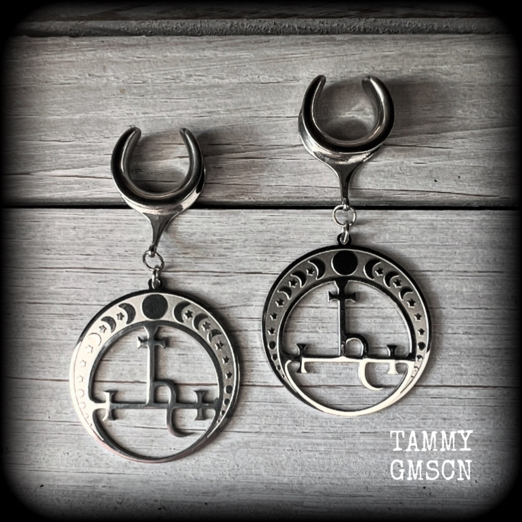 These gorgeous stainless steel earrings feature the Sigil of Lilith surrounded by moon phases, lovely and light weight at only 9 grams each, and measure just over 7cms from tip to tip.

This pair has been made on 5/8” gauge (16mm) surgical steel cradles, for stretched lobes.