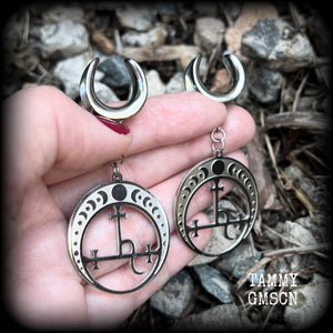 These gorgeous stainless steel earrings feature the Sigil of Lilith surrounded by moon phases, lovely and light weight at only 9 grams each, and measure just over 7cms from tip to tip.  This pair has been made on 5/8” gauge (16mm) surgical steel cradles, for stretched lobes.