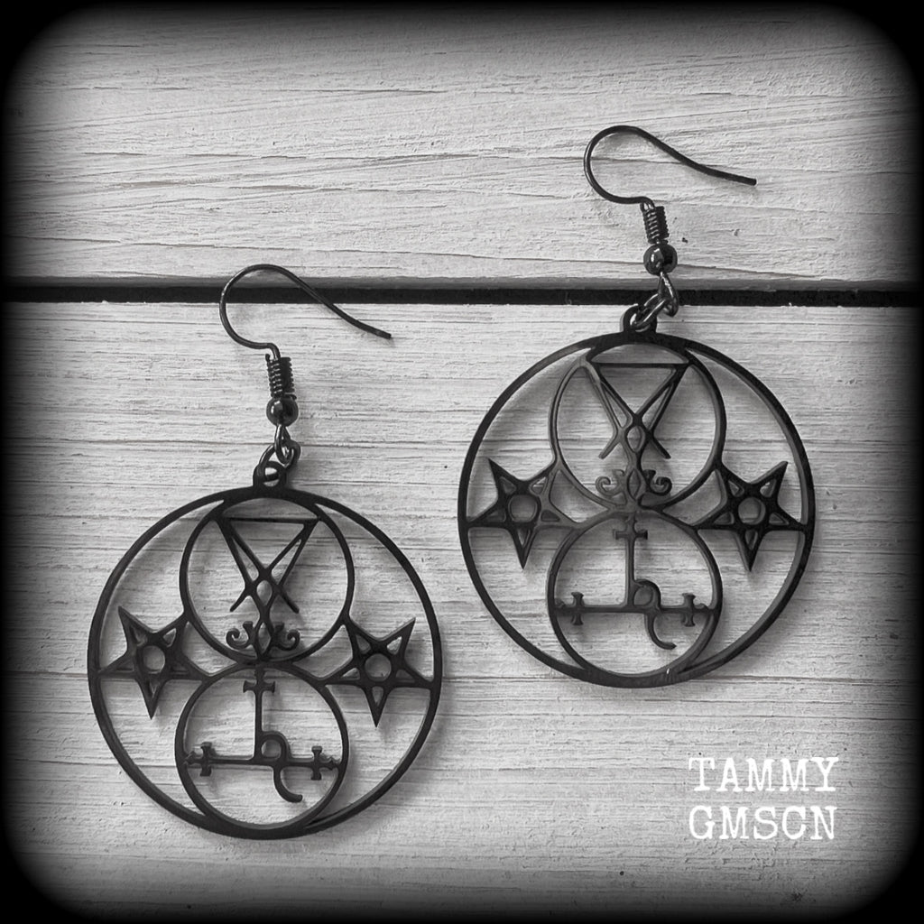 These gorgeous stainless steel earrings feature the Sigil of Lilith with the Sigil of Lucifer flanked by inverted pentagrams on each side. These earrings are lovely and light weight, weighing approx only a gram or two each, and measure just on 6 cms from tip to tip.

This pair has been made with french hooks, for pierced ears.
