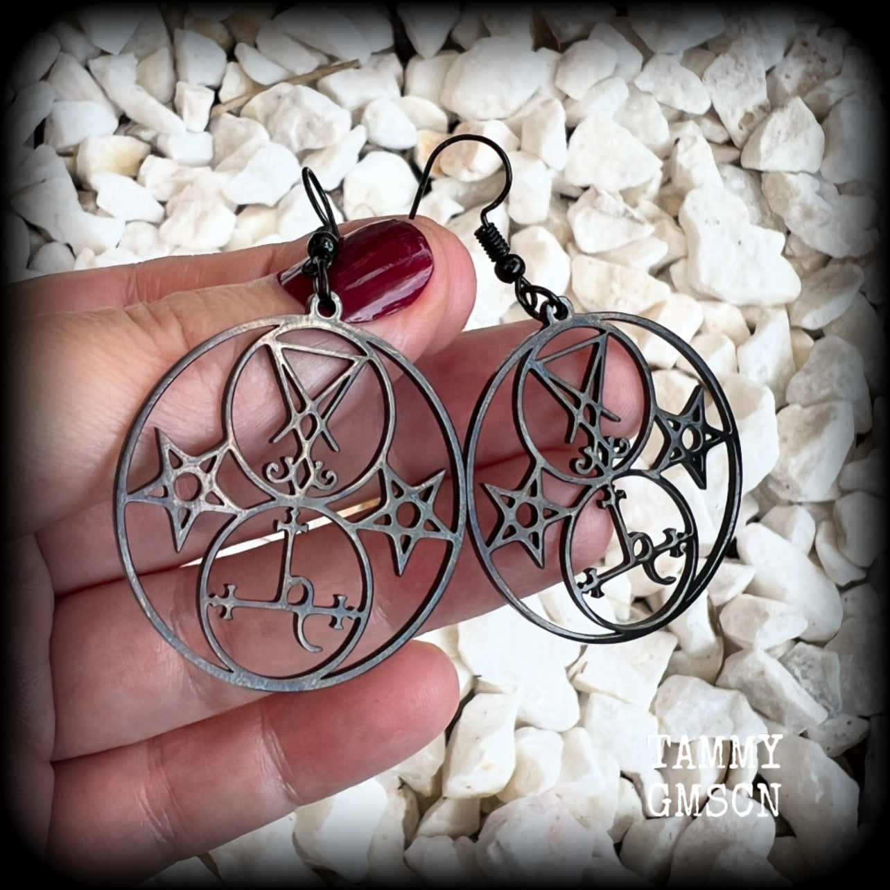 These gorgeous stainless steel earrings feature the Sigil of Lilith with the Sigil of Lucifer flanked by inverted pentagrams on each side. These earrings are lovely and light weight, weighing approx only a gram or two each, and measure just on 6 cms from tip to tip.  This pair has been made with french hooks, for pierced ears.