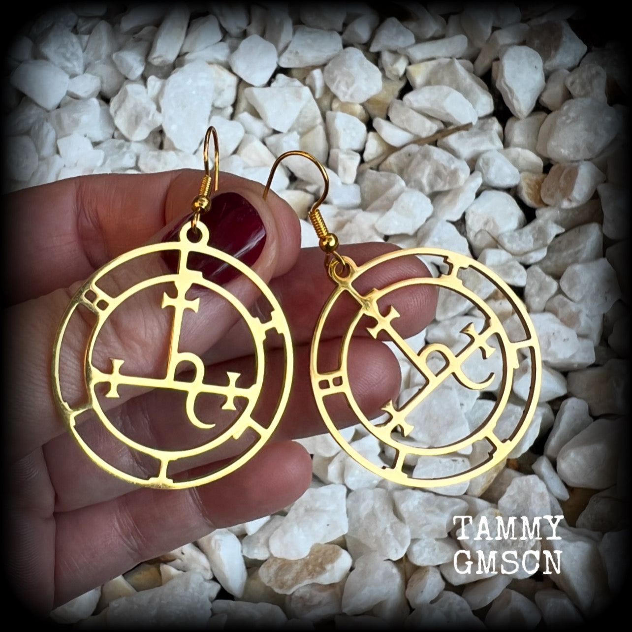These gorgeous gold stainless steel earrings feature the Sigil of Lilith as it appears in The Lesser Key of Solomon, and are lovely and light weight, weighing only a few grams each, and measure just on 5.5cms from tip to tip.

This pair has been made with french hooks, suitable for pierced ears.