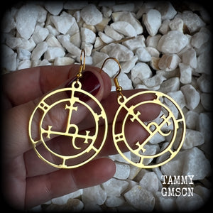These gorgeous gold stainless steel earrings feature the Sigil of Lilith as it appears in The Lesser Key of Solomon, and are lovely and light weight, weighing only a few grams each, and measure just on 5.5cms from tip to tip.

This pair has been made with french hooks, suitable for pierced ears.