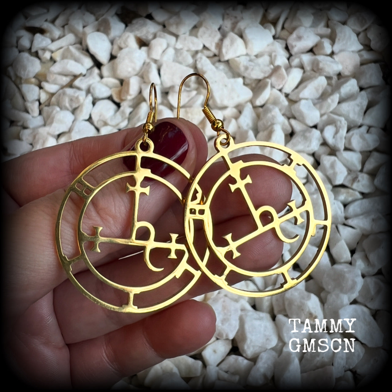 These gorgeous gold stainless steel earrings feature the Sigil of Lilith as it appears in The Lesser Key of Solomon, and are lovely and light weight, weighing only a few grams each, and measure just on 5.5cms from tip to tip.

This pair has been made with french hooks, suitable for pierced ears.