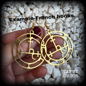 These gorgeous gold stainless steel earrings feature the Sigil of Lilith as it appears in The Lesser Key of Solomon, and are lovely and light weight, weighing only a few grams each, and measure just on 5.5cms from tip to tip.

This pair has been made with french hooks, suitable for pierced ears.