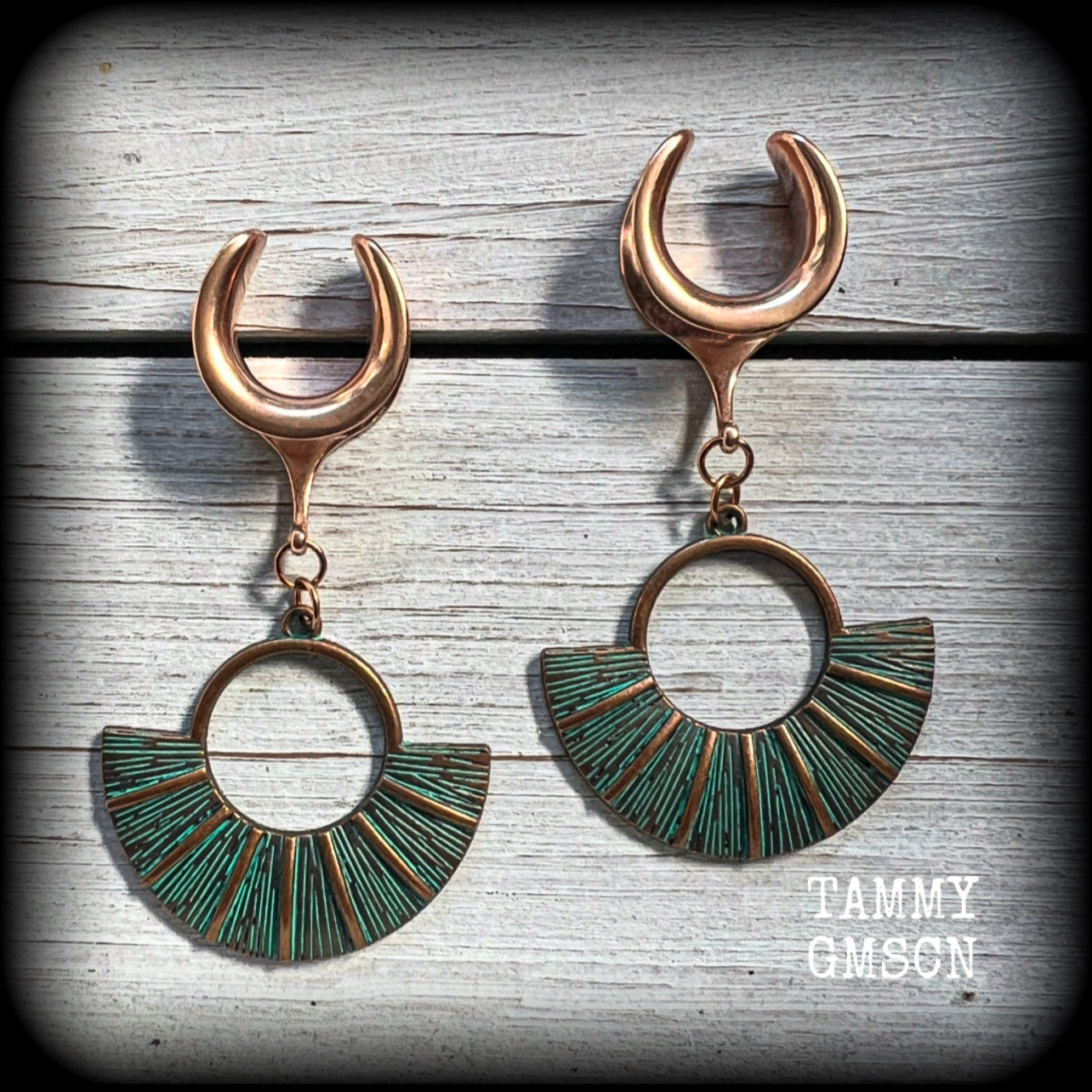 Inspired by Ishtar, Mesopotamian Goddess of love, beauty, sex and war, these beautiful patina and rose gold battle shield gauged earrings weigh approx 8 grams a piece, and measure just under 7 cms from tip to tip.

This pair have been made on 5/8” gauge (16mm) surgical steel cradles, suitable for stretched lobes.