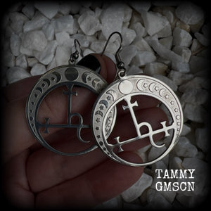 These gorgeous stainless steel earrings feature the Sigil of Lilith surrounded by moon phases, lovely and light weight at only 5 grams each, and measure just over 5.5cms from tip to tip.


This pair have been made with stainless steel french hooks, to be worn in pierced ears.
