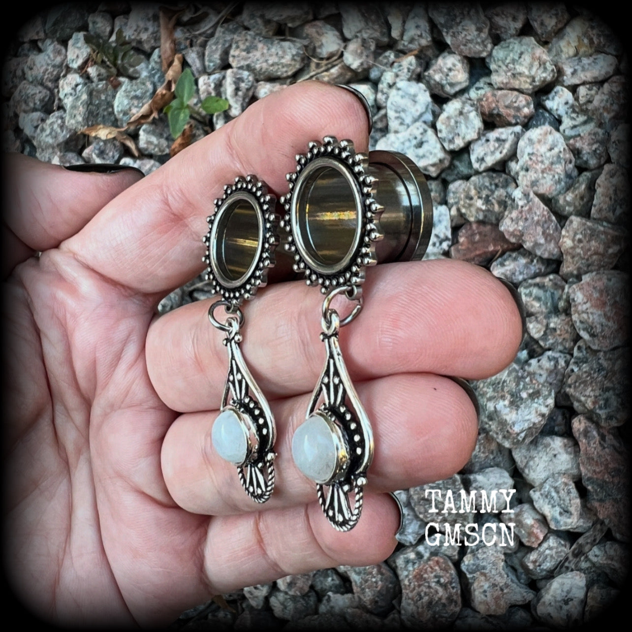 These beautiful earrings have been made with gorgeous polished rainbow moonstone gemstones in a beautiful boho antique silver setting, are nice and light weight, weighing approx 8 grams each and measuring 5cm from tip to tip. 

These gorgeous tunnel dangles have been made with 9/16" (14mm) gauge surgical steel ornate screw fit tunnels.