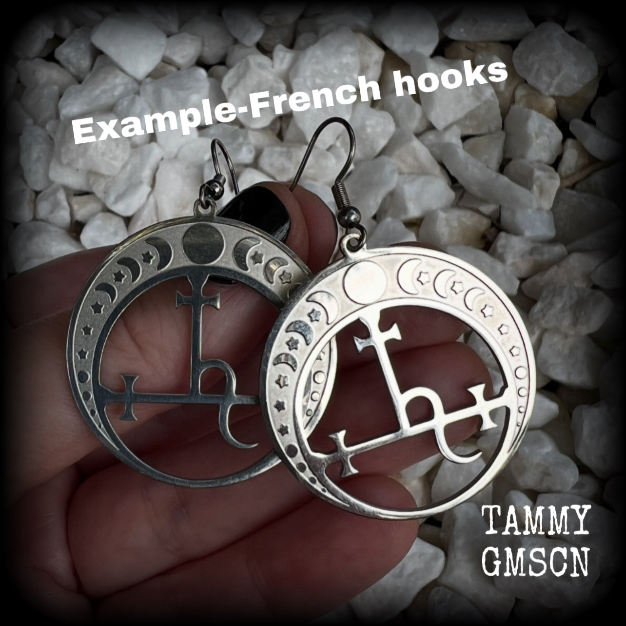 These gorgeous stainless steel earrings feature the Sigil of Lilith surrounded by moon phases, lovely and light weight at only 5 grams each, and measure just over 5.5cms from tip to tip.


This pair have been made with stainless steel french hooks, to be worn in pierced ears.
