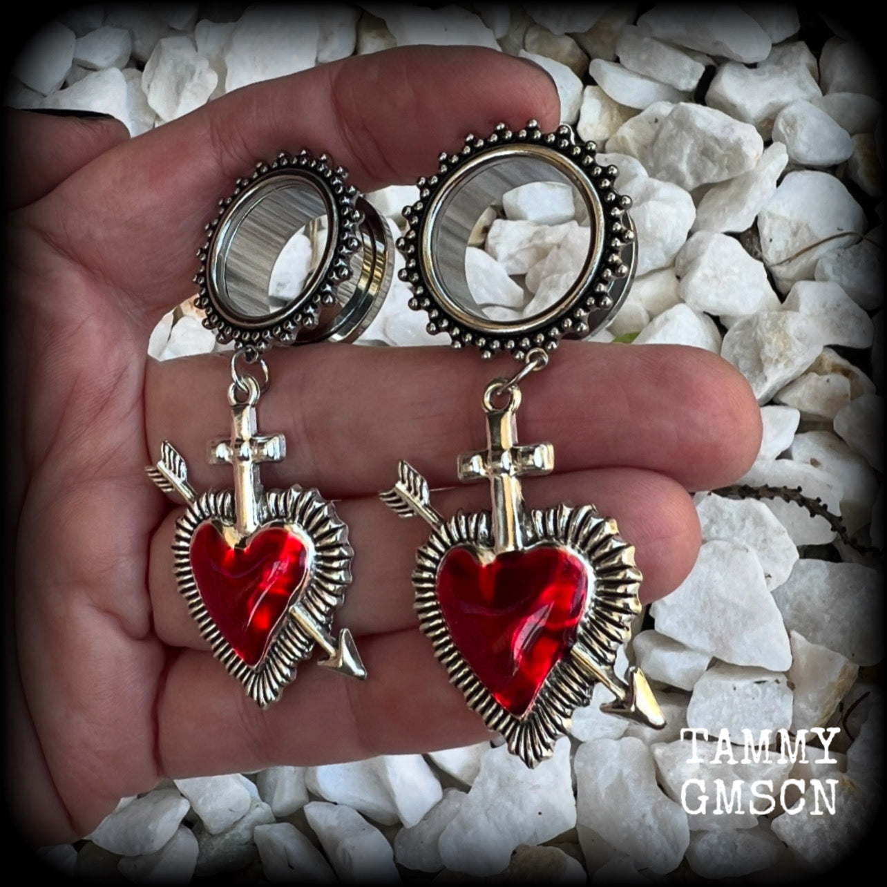 These gorgeous tunnel earrings feature beautiful antique silver and red enamel hearts pierced by silver arrows, are nice and lightweight, weighing only 12 grams each and measure approx 7cms from tip to tip.  This pair has been made with 3/4" (19mm) gauge ornate surgical steel screw fit tunnels.