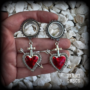 These gorgeous tunnel earrings feature beautiful antique silver and red enamel hearts pierced by silver arrows, are nice and lightweight, weighing only 12 grams each and measure approx 7cms from tip to tip.  This pair has been made with 3/4" (19mm) gauge ornate surgical steel screw fit tunnels.