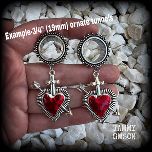 These gorgeous tunnel earrings feature beautiful antique silver and red enamel hearts pierced by silver arrows, are nice and lightweight, weighing only 12 grams each and measure approx 7cms from tip to tip.  This pair has been made with 3/4" (19mm) gauge ornate surgical steel screw fit tunnels.
