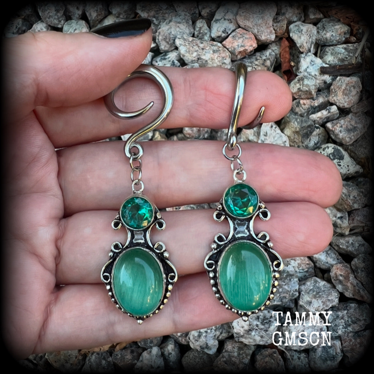These earrings feature gorgeous green topaz and cats eye gemstones in a lovely boho antique silver setting, lovely and dangly at just over 6cms from tip to tip, and weighing approx 9 grams each.  These earrings have been made on 6 gauge (4mm) surgical steel full curl hooks, to be worn in stretched lobes.
