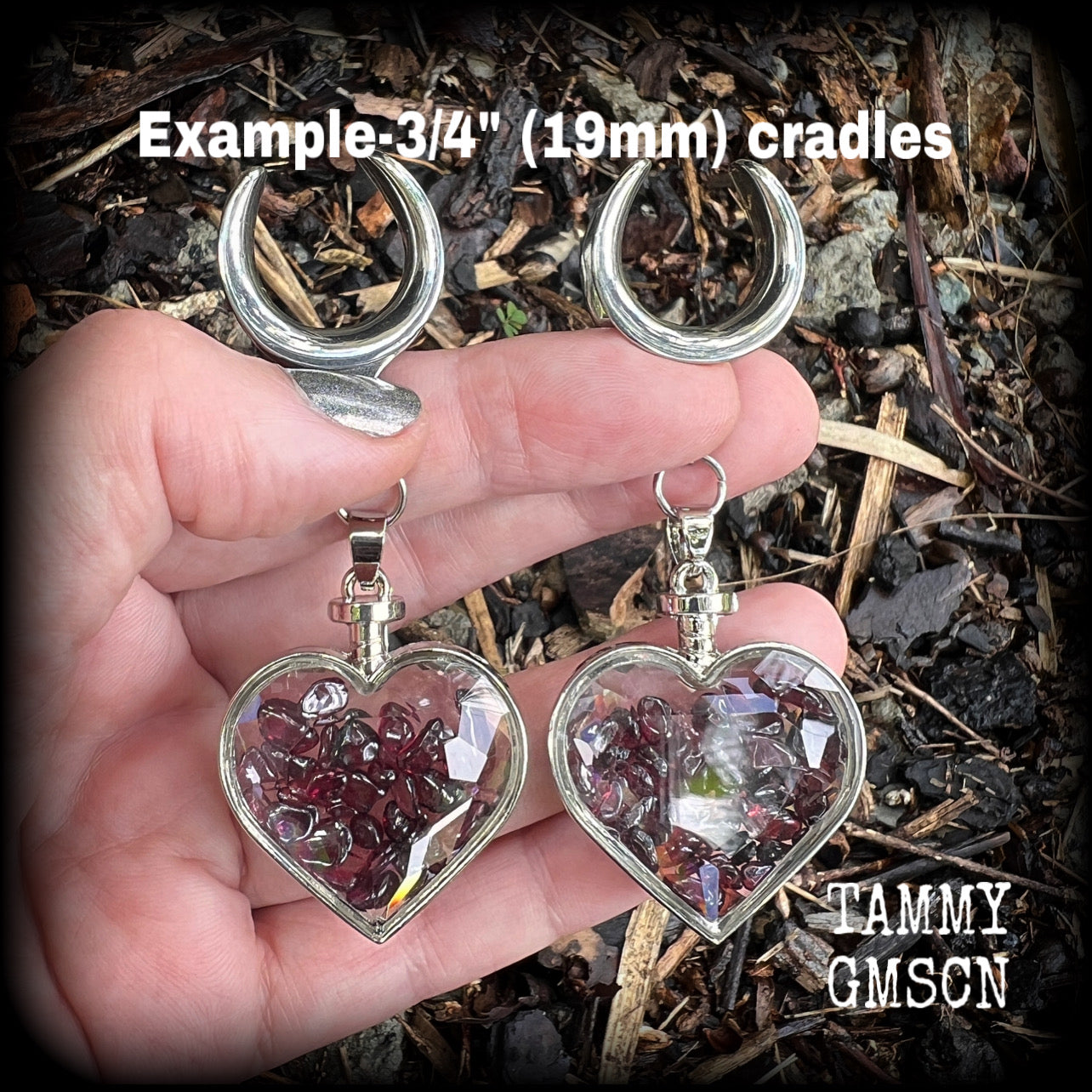 Heart shaped glass bottles filled with garnet gemstone chips, available on a range of hooks and clasps for pierced ears and stretched lobes.