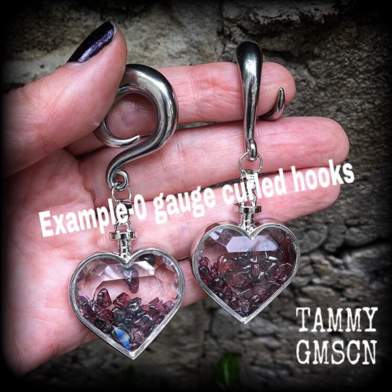 Heart shaped glass bottles filled with garnet gemstone chips, available on a range of hooks and clasps for pierced ears and stretched lobes.